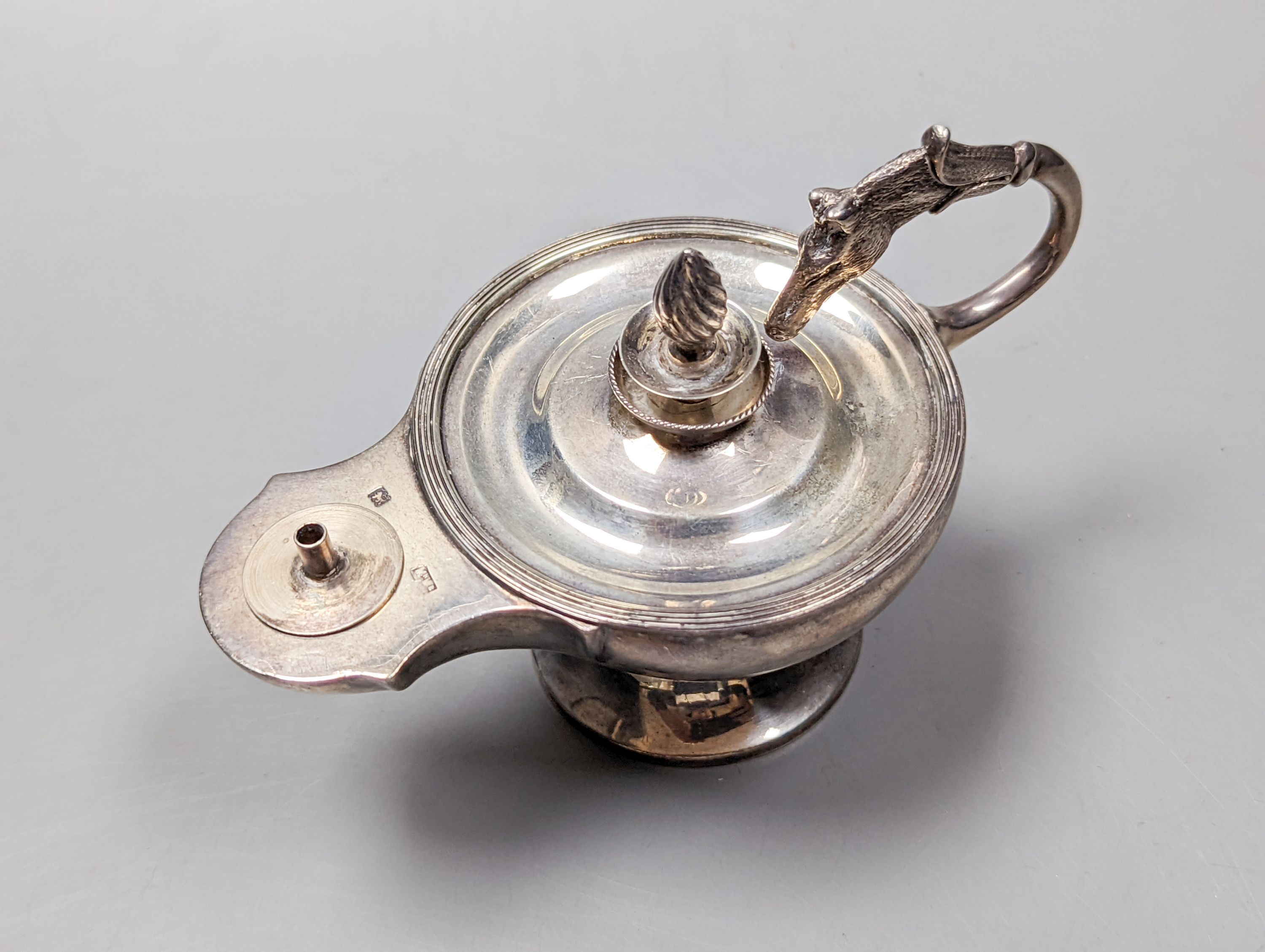 An Edwardian silver club lighter, of lamp form, with horse's head handle, Mappin & Webb, London, 1909, length 13.7cm.